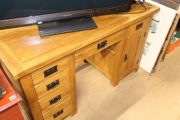 An oak desk, 135cm wide, 60cm deep, 80cm high