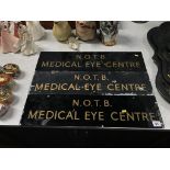 A set of three glass wall mounted signs, 'N.O.T.B. Medical Eye Centre', 61cm width