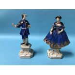 A pair of Continental porcelain figures of a gallant and a lady, blue printed 'R' to base,
