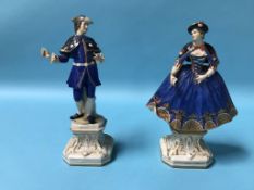 A pair of Continental porcelain figures of a gallant and a lady, blue printed 'R' to base,