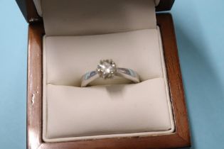 An 18ct white gold solitaire ring, 4.1g, size 'M', 0.8ct