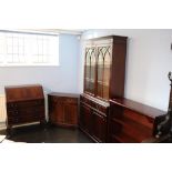 A reproduction bureau, bookcase, small cabinet and an open bookcase