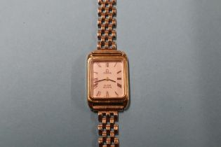 A ladies Omega wristwatch, with 9ct strap and box