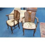 A pair of walnut bergère elbow chairs