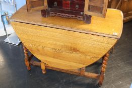 An oak barley twist gateleg table