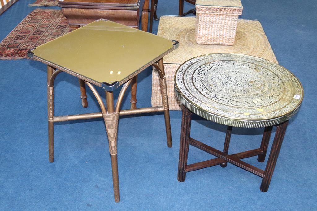 An Indian brass folding table and gold colour occasional tables