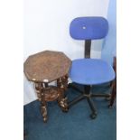 A carved octagonal table and typist chair