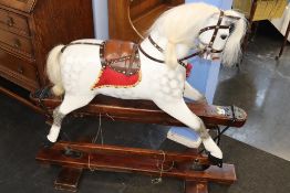 A child's rocking horse, 100cm high, 105cm wide