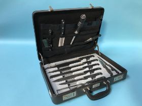 A cased carving knife set