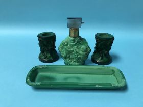 An Art Deco style Ingrid malachite glass perfume bottle, tray and a pair of candlesticks