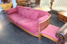 An Ercol settee and footstool