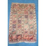 A Qashgai rug, the double medallion upon a midnight blue ground with allover flower head design,