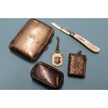 A silver vesta, gold fob cigarette case etc.