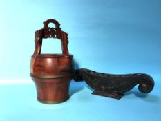 Modern wooden water jug and a carved wood stand