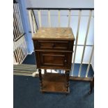 A walnut and marble top side cabinet