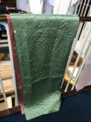 A green Durham quilt with pink reverse