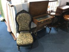 A campaign style desk, fire screen and a nursing chair