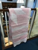 A salmon pink Durham quilt