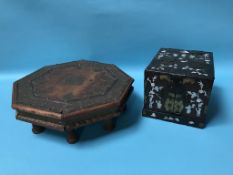 A modern mother of pearl casket and an octagonal table