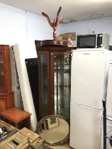 Corner cabinet, occasional table and an oval mirror