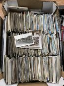 A large box containing a collection of old Postcards