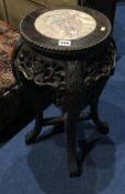 A Chinese marble inset pedestal table