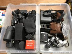Two trays of various camera bodies, lenses and camera accessories