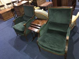 A pair of armchairs, with green upholstery