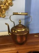 A copper and brass kettle
