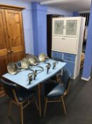 A Well Maid kitchen cabinet and a Formica matching table and four chairs