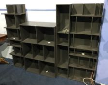 A collection of BoConcept grey open wall shelves