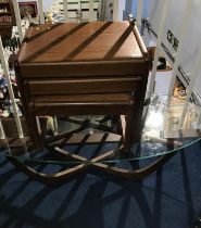 A G Plan teak and oval glass top table and a nest of tables