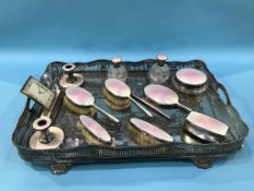 A silver pink enamelled thirteen piece dressing table set, Birmingham, various dates and a large