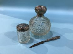 A silver topped scent bottle etc.