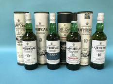 Four bottles of Laphroaig 10 year old Scotch whisky