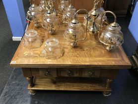 A square oak coffee table, with drawers