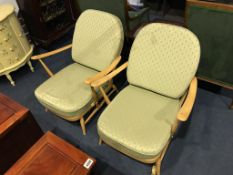 A pair of Ercol Golden Dawn armchairs