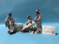 A Lladro group of two Japanese ladies on a bridge, with another figure