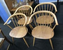 A set of four pale elm Ercol 'Cow Horn' dining chairs, model 449A