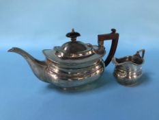 A silver bachelors tea pot and small cream jug, Birmingham, total weight 13.9oz