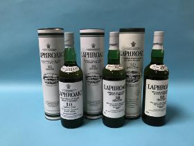 Three bottles of Laphroaig 10 year old Scotch whisky