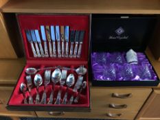 Six boxed Edinburgh crystal whisky glasses and a canteen of cutlery