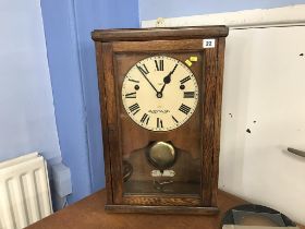 An oak cased 8 day wall clock, 'North East Time Recorder Limited'