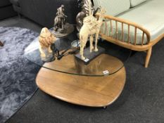 An Ercol glass top coffee table, 90cm wide