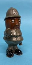 A John Hassall brass and ceramic policeman car mascot, 'Robert', circa 1910, signed on the waist,