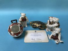 A Royal Crown Derby scuttle, three Royal Crown Derby Bears and a paperweight