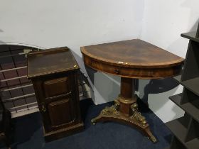 A 19th century Empire style corner table and a bedside cabinet