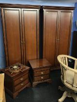 Two Stag modern wardrobes and a pair of bedside chests