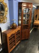 An Oriental corner cabinet and a small Oriental glazed bookcase, 88cm wide