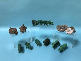 Collection of carved malachite animals, fossils etc.